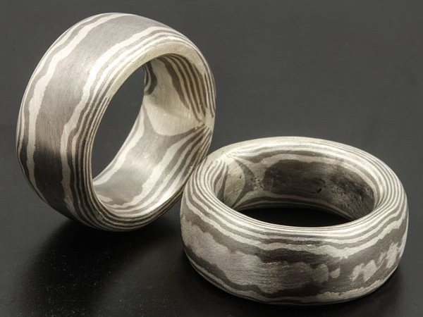 Two wide Mokume Gane bands, the wood grain running right through the metal