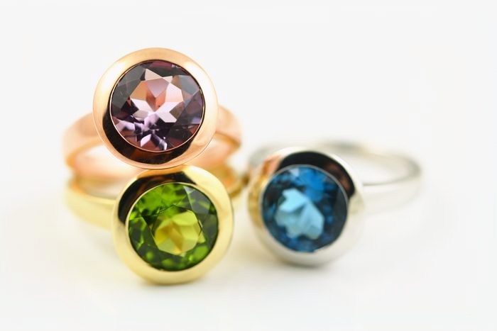 Amethyst, Peridot and Topaz stacking rings: Amethyst, Peridot and blue Topaz set in 18 karat gold