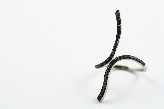 Black diamond crossover ring: black diamonds set in 18 karat white gold