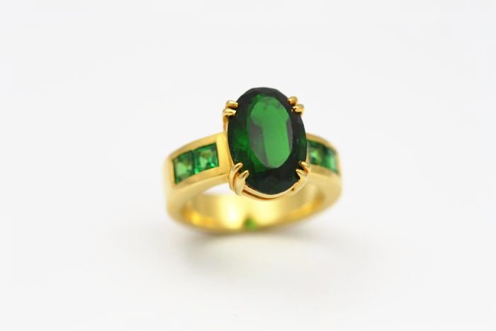 Chrome Tourmaline and Tsavorite ring: a Chrome Tourmaline with Tsavorites in 18 karat yellow gold