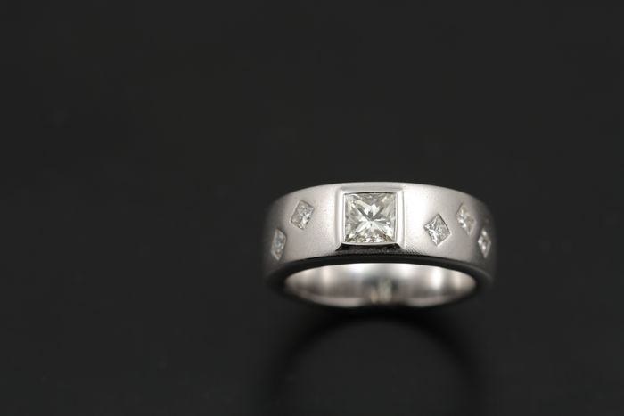 Princess cut diamond band: diamonds set in 18 karat white gold