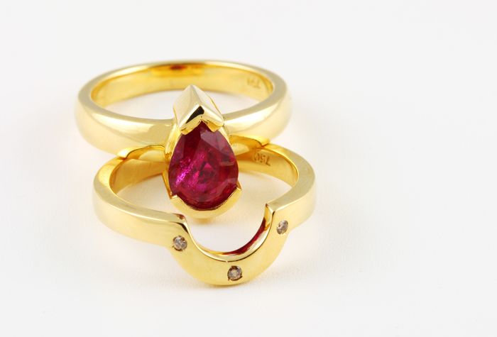 Ruby and diamond double band: a Ruby with diamonds in 18 karat yellow gold