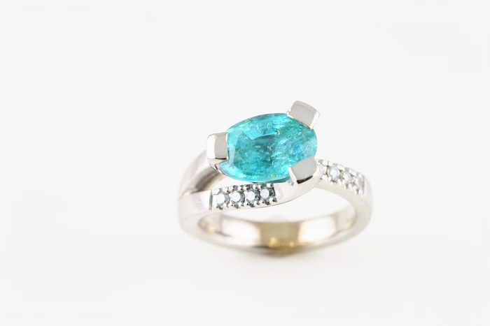 Paraiba Tourmaline and diamond ring: a Paraiba Tourmaline with diamonds in 18 karat white gold