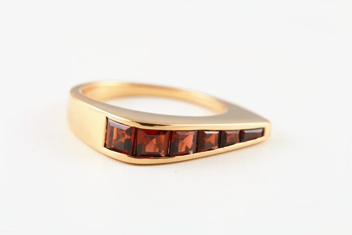 Garnet channel ring: Garnets set in 18 karat rose gold