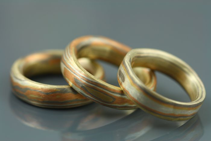 Three Mokume Gane bands: each made from 18 karat rose, white and yellow gold with silver