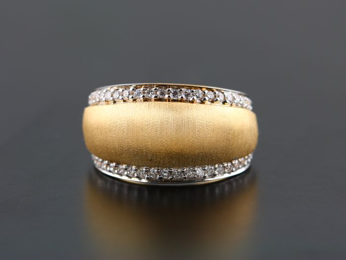 Textured dome band: diamonds set in 18 karat white gold in an 18 karat matte finished yellow gold domed ring