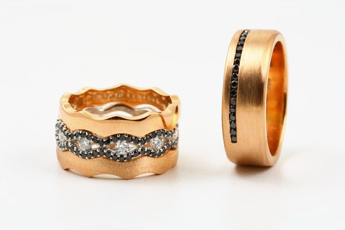 Black and white diamond bands: black and colourless diamonds set in 18 karat rose gold
