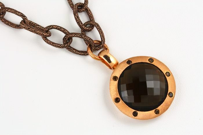 Smoky Quartz round pendant: a Smoky Quartz set in 18 karat rose gold