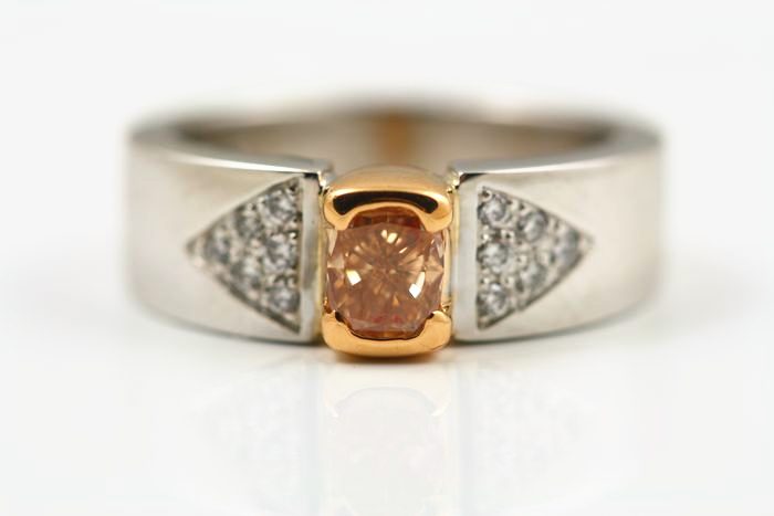 Brownish pink diamond ring: a brownish pink diamond with diamonds in 18 karat white and rose gold