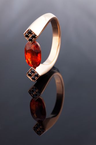 Ring of Fire: a Garnet with black diamonds in 18 karat rose gold