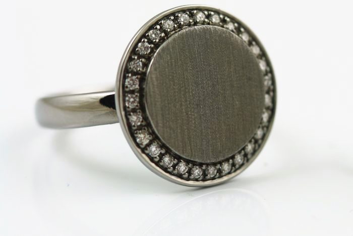 Diamond disc ring: diamonds set in 18 karat white gold