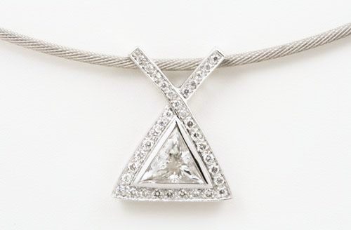 Diamond triangle pendant: diamonds set in 18 karat white gold