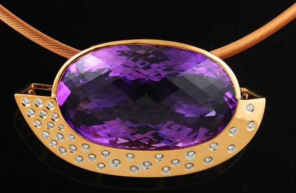 Amethyst oval pendant: an Amethyst with diamonds in 18 karat rose gold