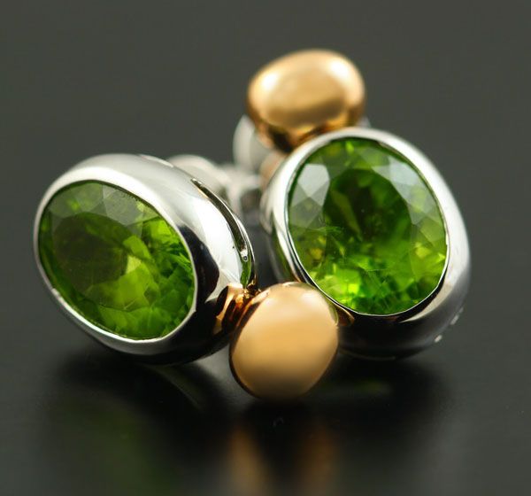 Peridot oval earrings: Peridots set in 18 karat white and yellow gold
