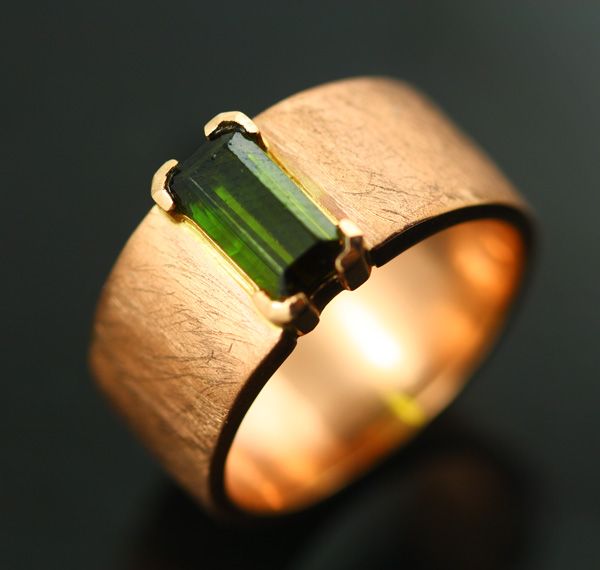 Tourmaline wide band: a green Tourmaline set in 18 karat rose gold