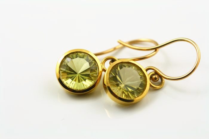 Peridot drops: Peridots set in 18 karat yellow gold