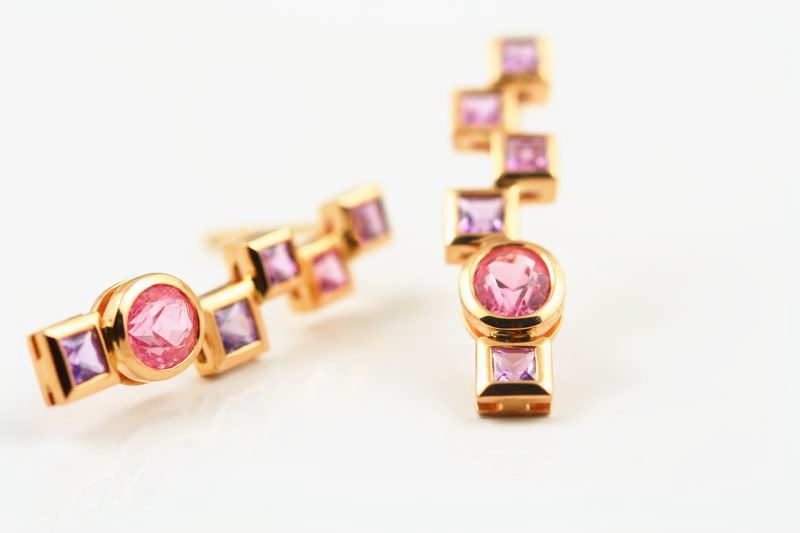 Rose gold drop earrings of square and round pink stones stepping down